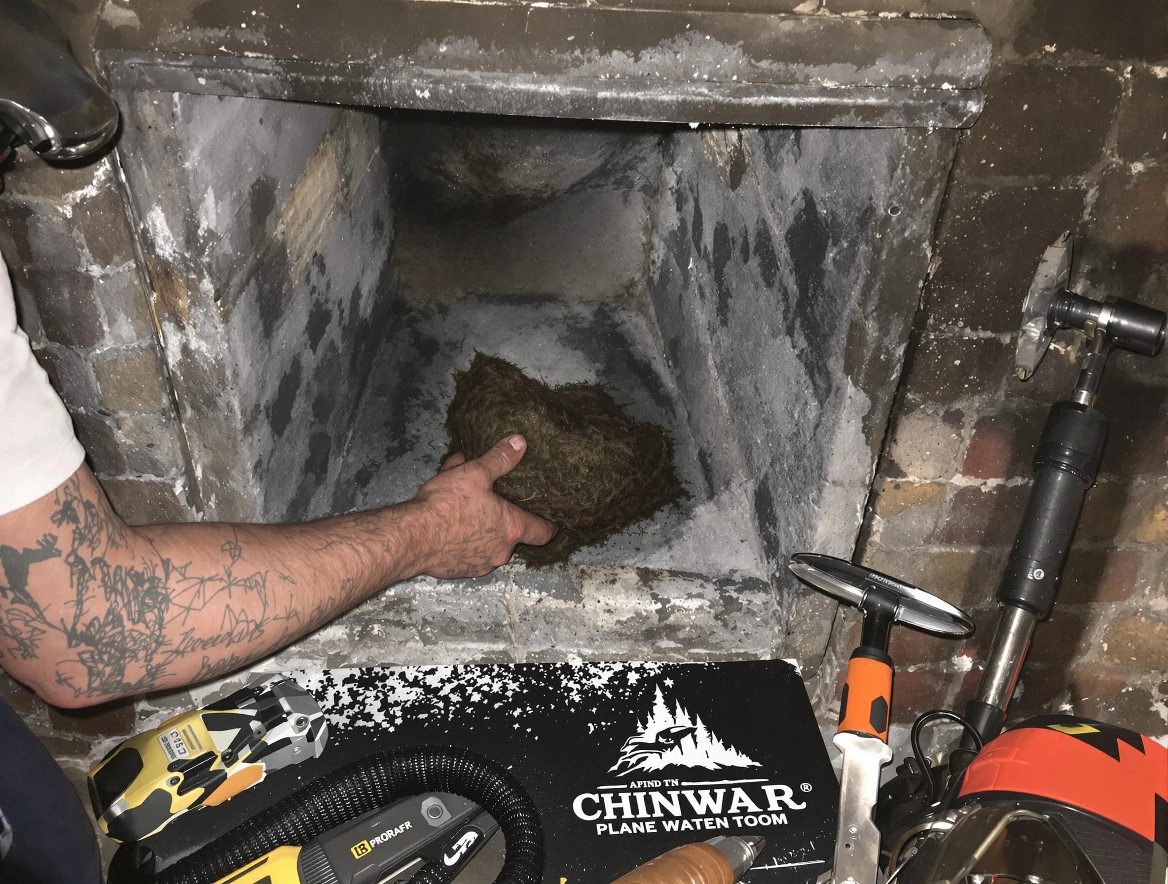 Druid Hills Chimney Sweep safely removing debris and screening chimney in Druid Hills, GA